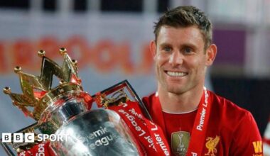 James Milner with the Premier League trophy after Liverpool's title win in 2020