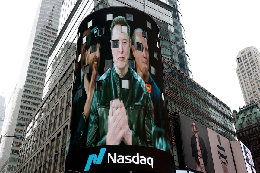 An image of Elon Musk on the New York Stock Exchange tower.