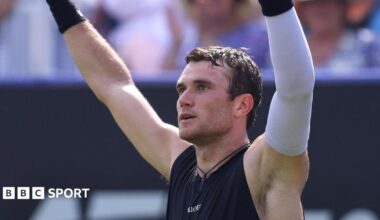 Jack Draper lifts his arms in celebration after winning his quarter-final at Eastbourne