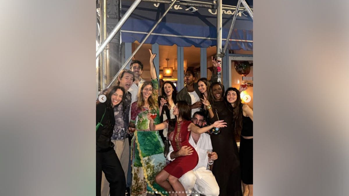 Emily Ratajkowski with her friends outside of a bar in New York.