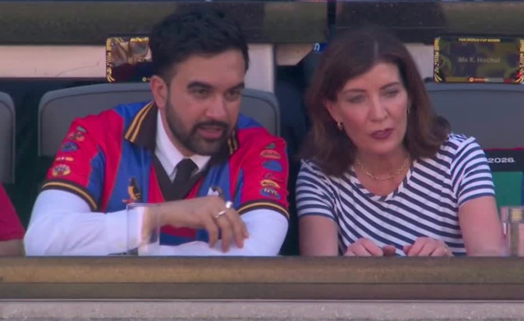 New York State Assemblyman Zohran Mamdani and Governor Kathy Hochul watching a World Cup game.