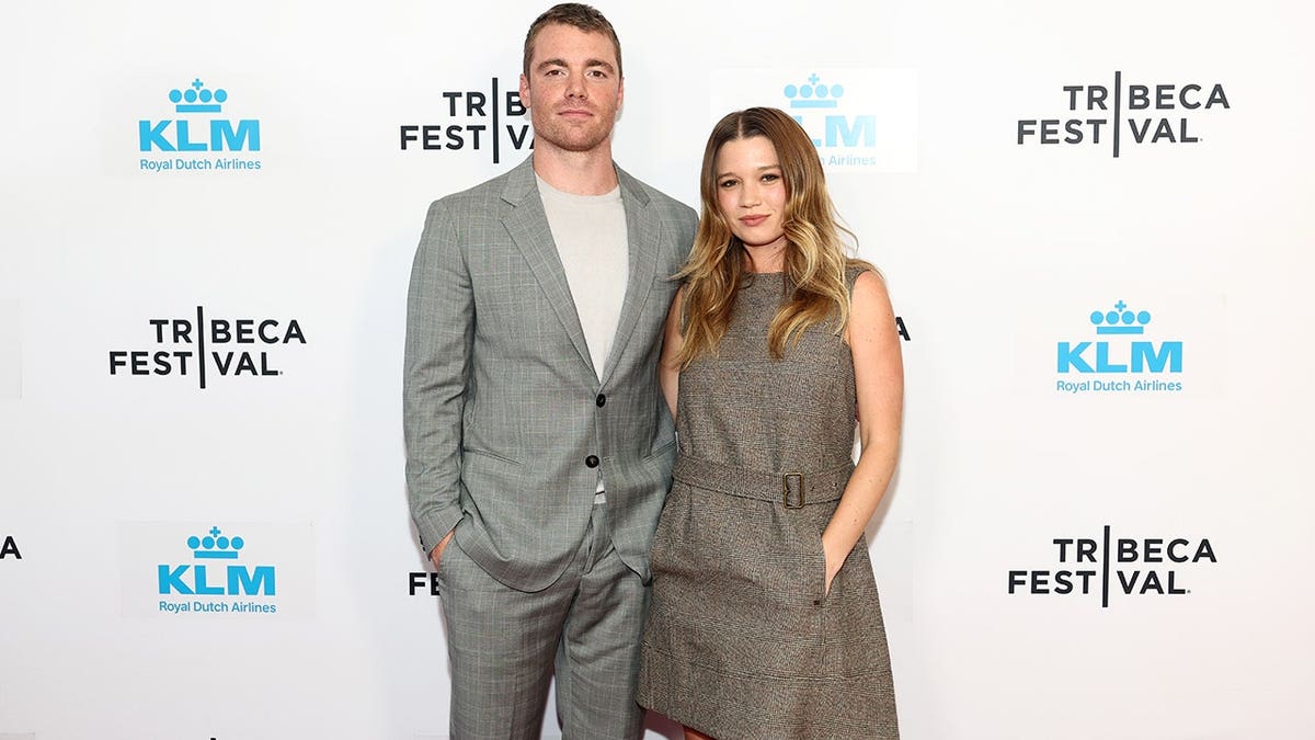 Gabriel Basso and Rain Spencer standing together at the Iconoclast premiere in New York City.