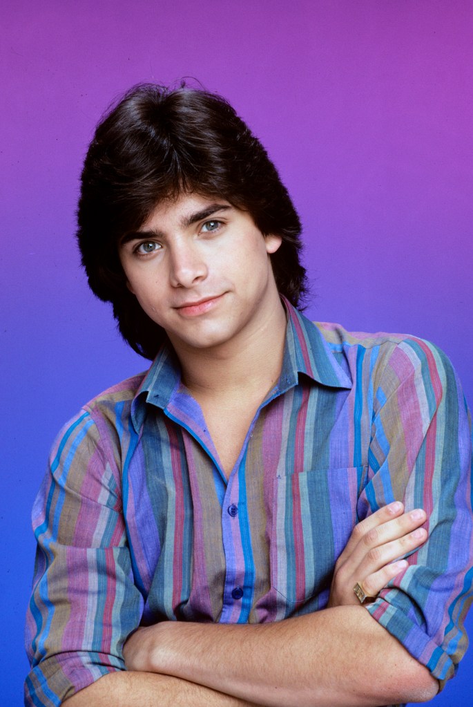 John Stamos in a striped shirt.