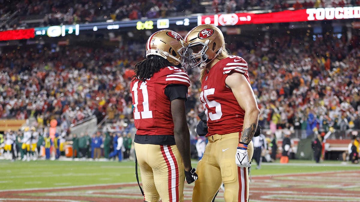 George Kittle and Brandon Aiyuk celebrating a touchdown at Levi's Stadium in Santa Clara