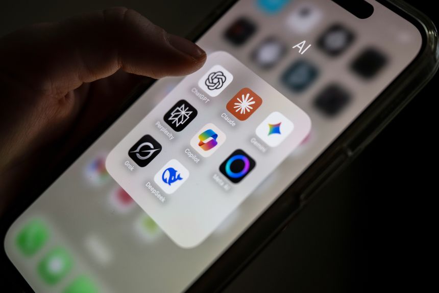 Several AI applications are arranged on a smartphone screen, including ChatGPT, Claude, Gemini, Perplexity, Microsoft Copilot, Meta AI, Grok and DeepSeek.