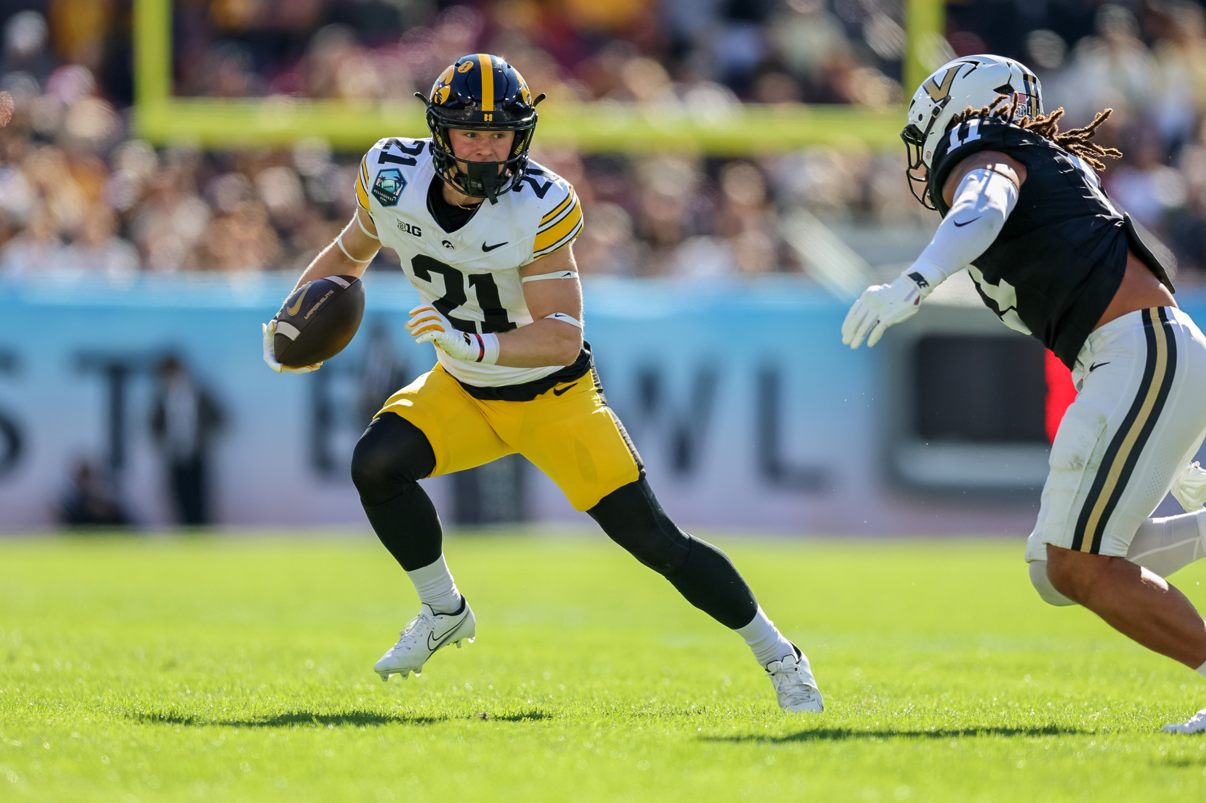 TAMPA, FLORIDA - DECEMBER 31: Kaden Wetjen #21 of the Iowa Hawkeyes runs against the Vanderbilt Commodores during the second half of the ReliaQuest Bowl at Raymond James Stadium on December 31, 2025 in Tampa, Florida. (Photo by Mike Carlson/Getty Images)