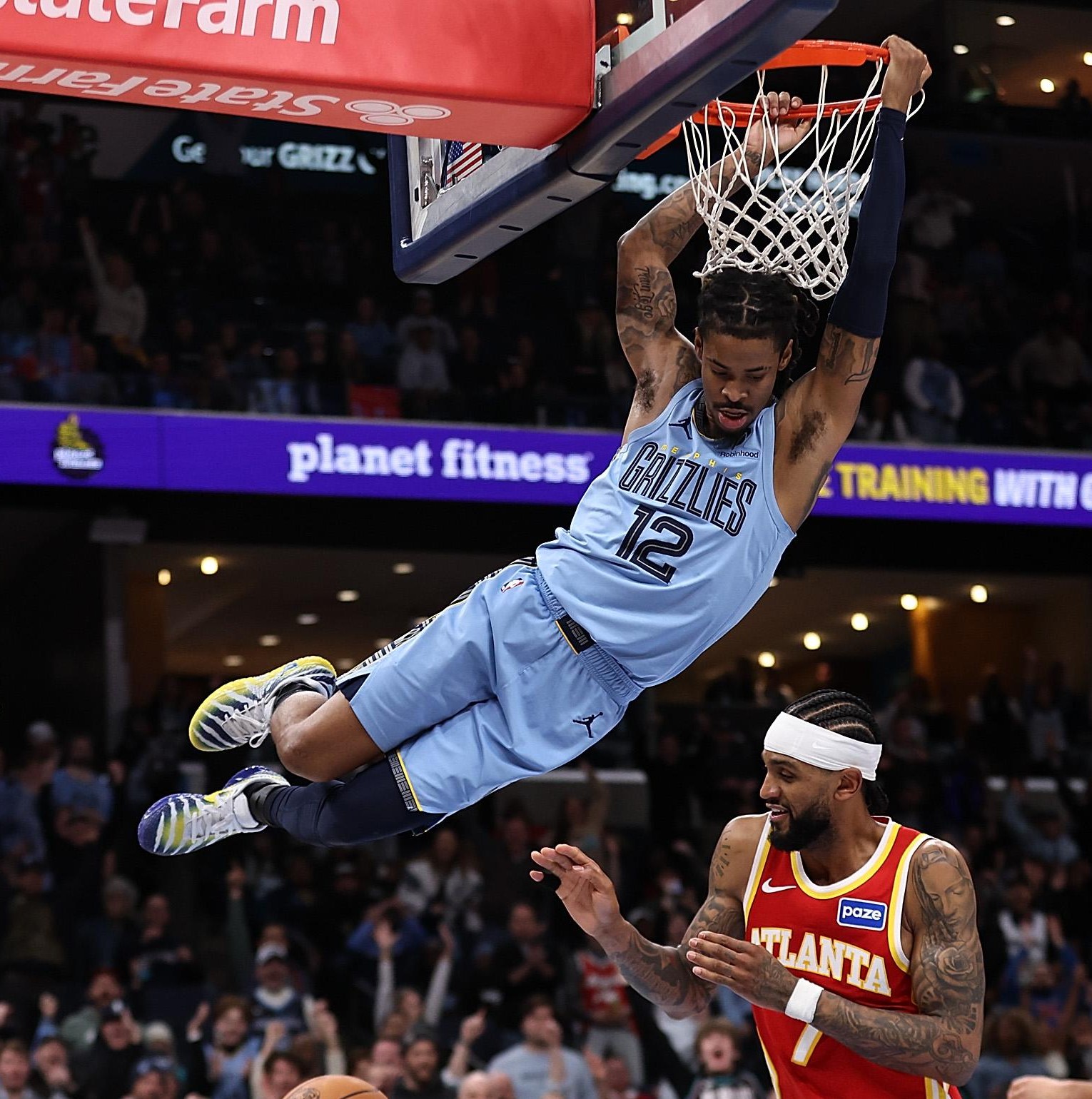 MEMPHIS, TENNESSEE - JANUARY 21: Ja Morant #12 of the Memphis Grizzlies goes to the basket against Nickeil Alexander-Walker #7 of the Atlanta Hawks during the second half at FedExForum on January 21, 2026 in Memphis, Tennessee. NOTE TO USER: User expressly acknowledges and agrees that, by downloading and or using this photograph, User is consenting to the terms and conditions of the Getty Images License Agreement. (Photo by Justin Ford/Getty Images)
