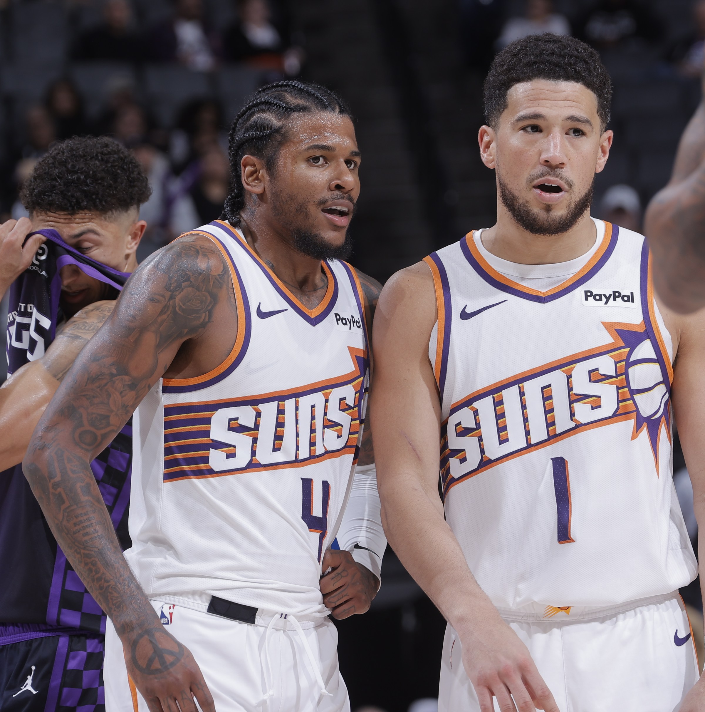 SACRAMENTO, CA - MARCH 3: Jalen Green #4 and Devin Booker #1 of the Phoenix Suns talk during the game against the Sacramento Kings on March 3, 2026 at Golden 1 Center in Sacramento, California. NOTE TO USER: User expressly acknowledges and agrees that, by downloading and or using this photograph, User is consenting to the terms and conditions of the Getty Images Agreement. Mandatory Copyright Notice: Copyright 2026 NBAE (Photo by Rocky Widner/NBAE via Getty Images)