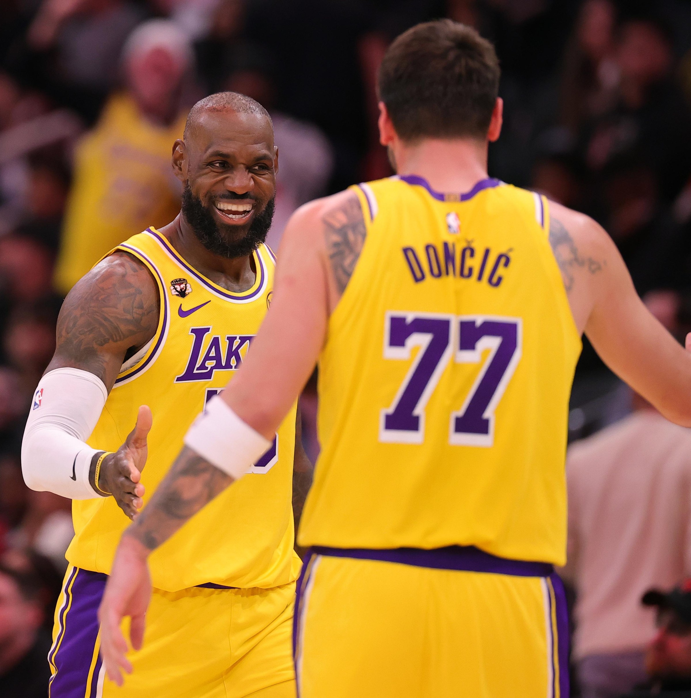 HOUSTON, TEXAS - MARCH 16: LeBron James #23 of the Los Angeles Lakers celebrates with teammate Luka Doncic #77 during the second half against the Houston Rockets at Toyota Center on March 16, 2026 in Houston, Texas. NOTE TO USER: User expressly acknowledges and agrees that, by downloading and or using this photograph, User is consenting to the terms and conditions of the Getty Images License Agreement. (Photo by Alex Slitz/Getty Images)