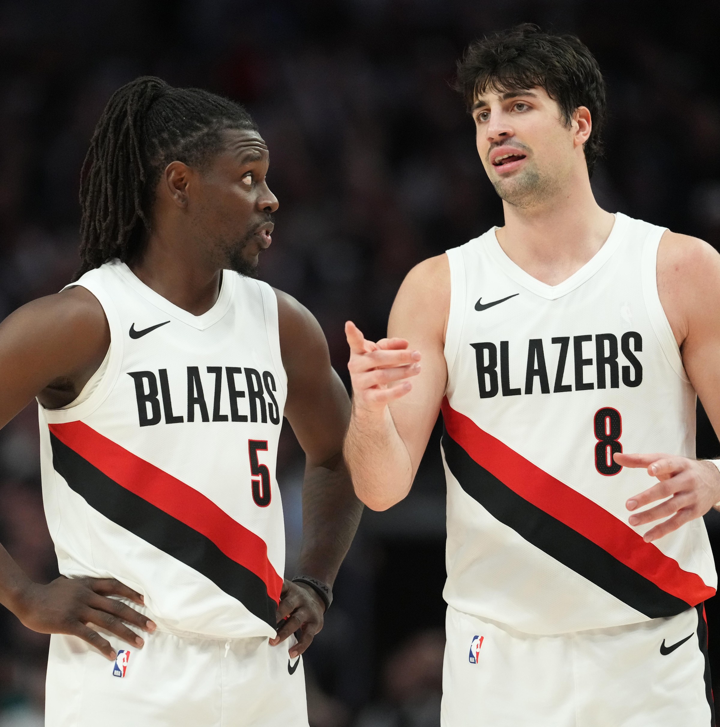 PORTLAND, OREGON - APRIL 10: Jrue Holiday #5 and Deni Avdija #8 of the Portland Trail Blazers talk during the second half against the Los Angeles Clippers at Moda Center on April 10, 2026 in Portland, Oregon. NOTE TO USER: User expressly acknowledges and agrees that, by downloading and or using this photograph, User is consenting to the terms and conditions of the Getty Images License Agreement. (Photo by Soobum Im/Getty Images)