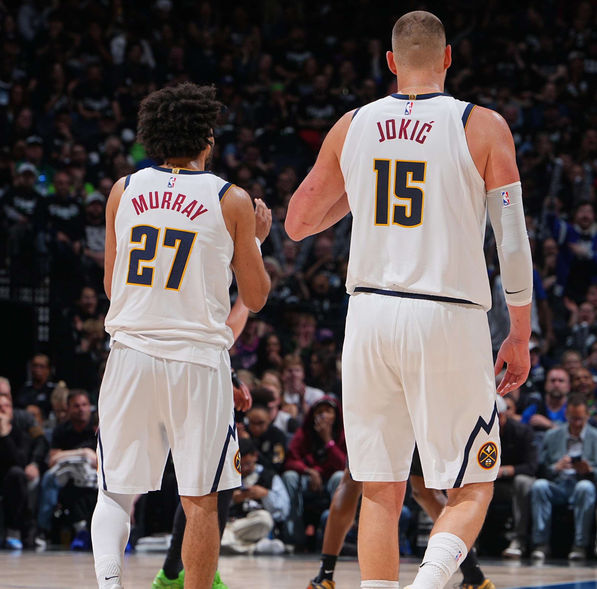 MINNEAPOLIS, MN - APRIL 23: Jamal Murray #27 and Nikola Jokic #15 of the Denver Nuggets looks on during the game against the Minnesota Timberwolvesduring Round One Game Three of the 2026 NBA Playoffs on April 23, 2026 at Target Center in Minneapolis, Minnesota. NOTE TO USER: User expressly acknowledges and agrees that, by downloading and or using this Photograph, user is consenting to the terms and conditions of the Getty Images License Agreement. Mandatory Copyright Notice: Copyright 2026 NBAE (Photo by Garrett Ellwood/NBAE via Getty Images)