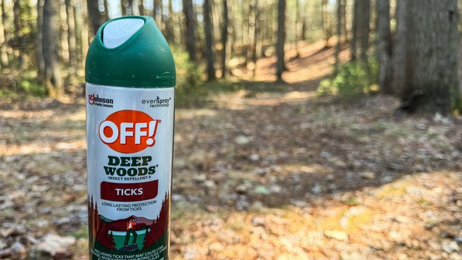 Can of OFF! Deep Woods Insect Repellent for Ticks ready to be applied at a hiking trail in Harpswell, Maine.