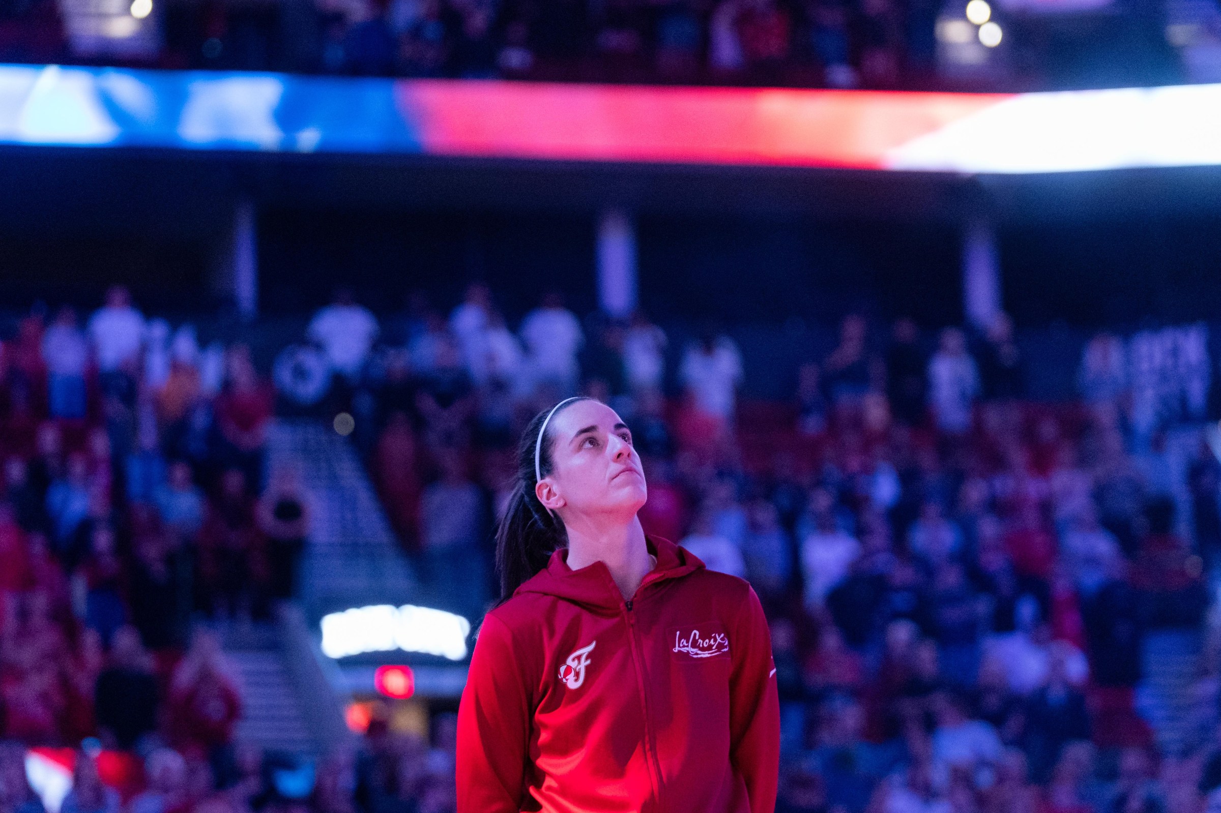 PORTLAND, OREGON - MAY 30: Caitlin Clark #22 of the Indiana Fever stands for the national anthem before the game against the Portland Fire at Moda Center on May 30, 2026 in Portland, Oregon. NOTE TO USER: User expressly acknowledges and agrees that, by downloading and or using this photograph, User is consenting to the terms and conditions of the Getty Images License Agreement. (Photo by Ali Gradischer/Getty Images)