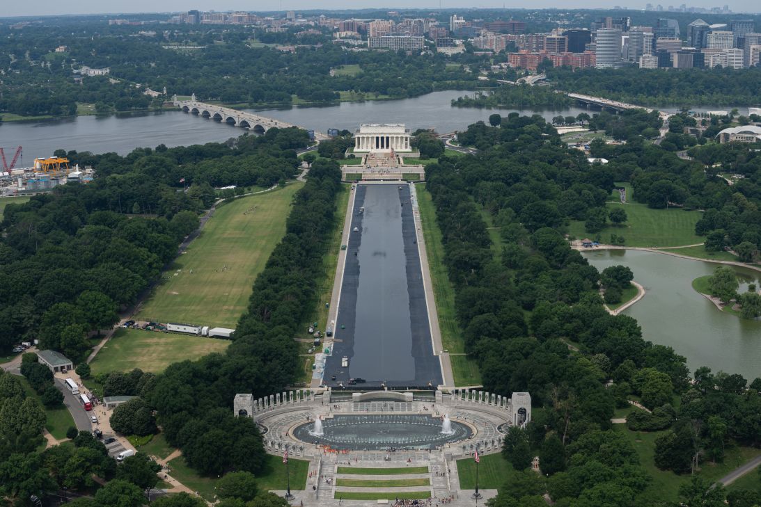 In an aerial view, people walk past the Reflecting Pool on the National Mall on June 6, 2026.