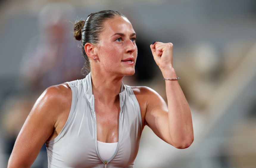 Marta Kostyuk celebrates during her quarterfinal win at this year's French Open.