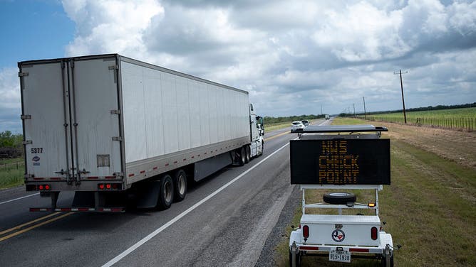 UVALDE, TEXAS - JUNE 6: People drive along U.S. Route 83 leaving La Pryor as they are warned of a livestock checkpoint set up by the Texas Animal Heath Commission in response to the New World Screwworm on June 6, 2026 in Uvalde, Texas.