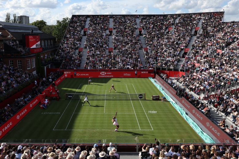 Serena Williams serves in front of a packed house at the Queen's Club in west London.