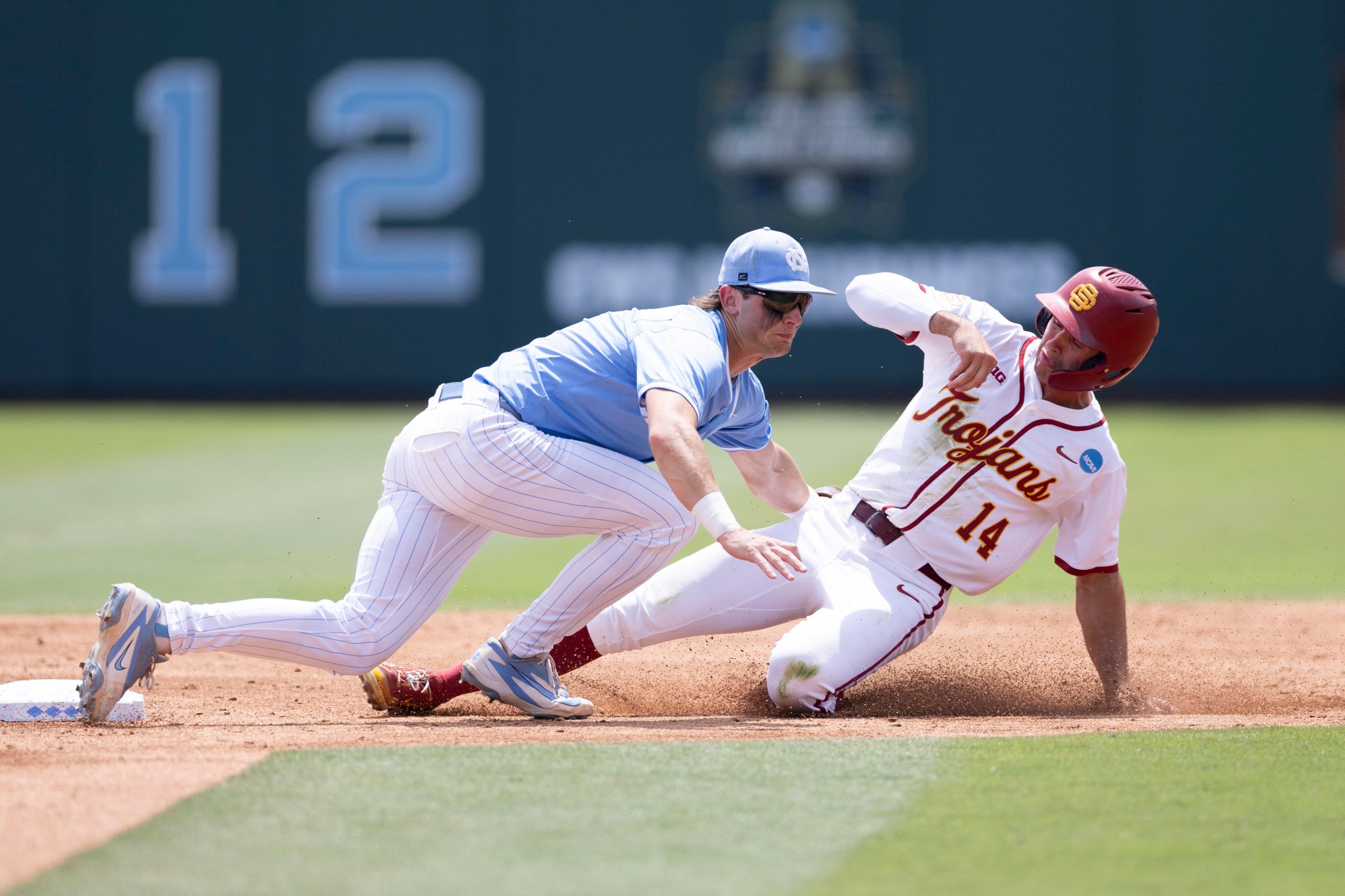 CHAPEL HILL, NC - JUNE 06, 2026: North Carolina Tar Heels Jake Schaffner (2) tags USC Trojans Jack Basseer (14) during game 2 of an NCAA baseball super regional at Bryson Field at Boshamer Stadium on Saturday, June 6, 2026 in Chapel Hill, NC. (Kara Durrette / Los Angeles Times via Getty Images)