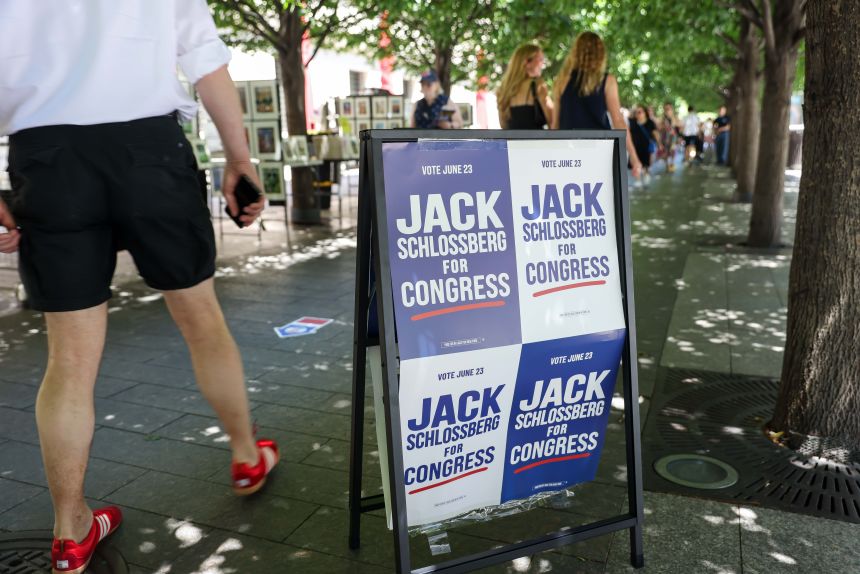 Campaign signage for Jack Schlossberg, US congressional candidate, outside a polling location at the Metropolitan Museum of Art on the first day of early voting for a primary election in New York, on June 13.