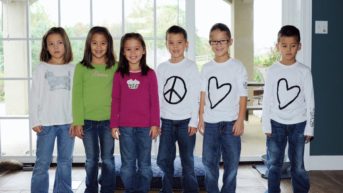 The Gosselin kids sitting together on Celebrity Wife Swap set.