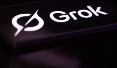 The Grok logo is displayed on a mobile phone screen