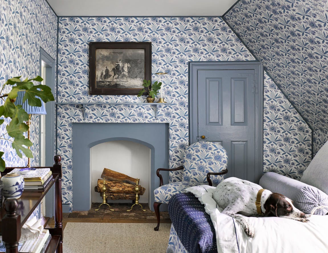 wallpaper ideas Heather Chadduck Hillegas Colonial Williamsburg Home Tour Twin Bedroom a blue and white bedroom with a dog on the bed