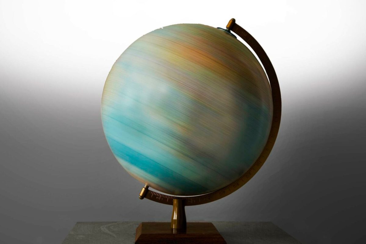 Photo of a model globe spinning so fast you cannot make out any countries or continents