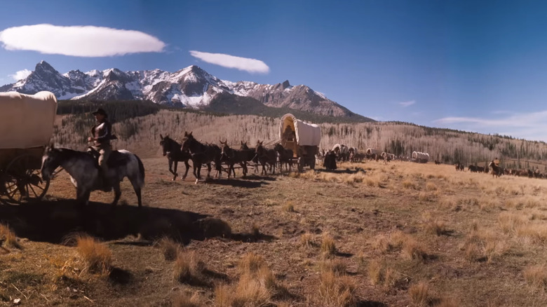 A wagon train works its way through rural land in How the West Was Won