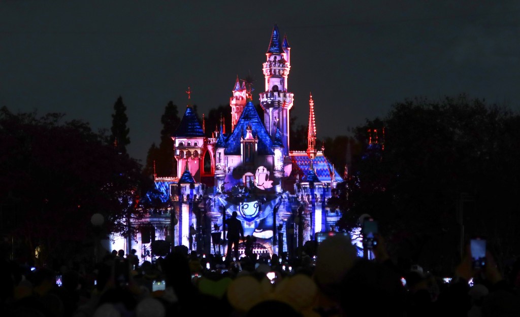 Mickey Mouse projected onto Sleeping Beauty Castle at Disneyland.