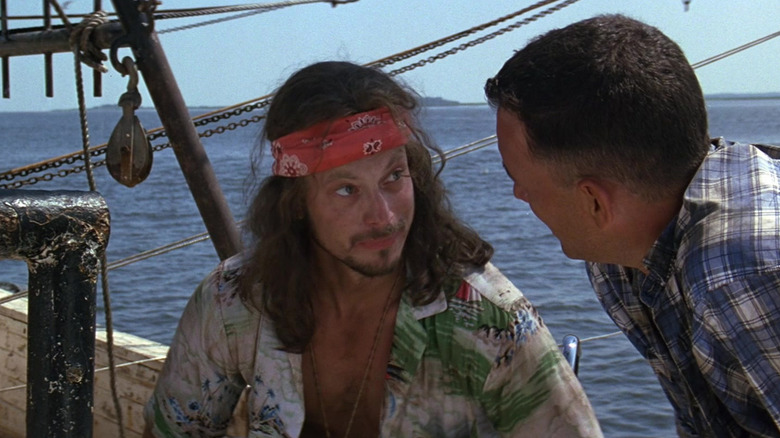 Gary Sinise as Lieutenant Dan Taylor speaks to Tom Hanks as Forrest Gump on a shrimping boat in Forrest Gump