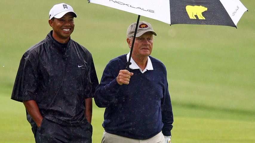 Tiger Woods (left) and Jack Nicklaus walk up a fairway during a skins game prior to the start of the Memorial Tournament in 2009. (Scott Halleran/Getty Images)