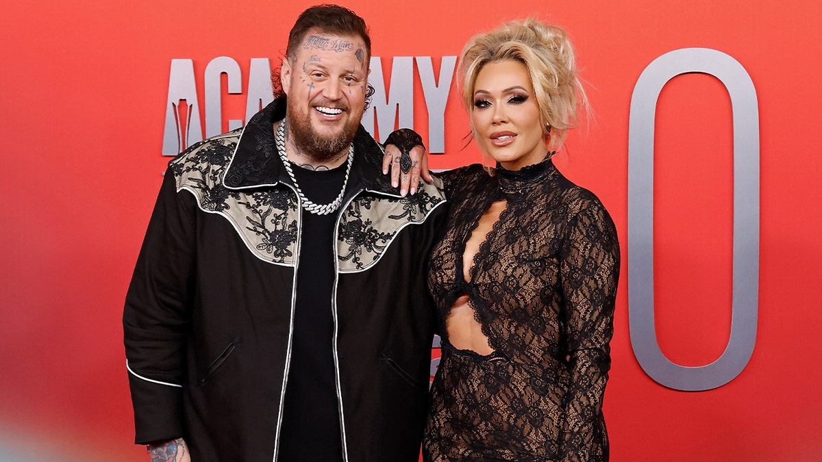 Jelly Roll and wife Bunnie XO on the red carpet at the ACM Awards