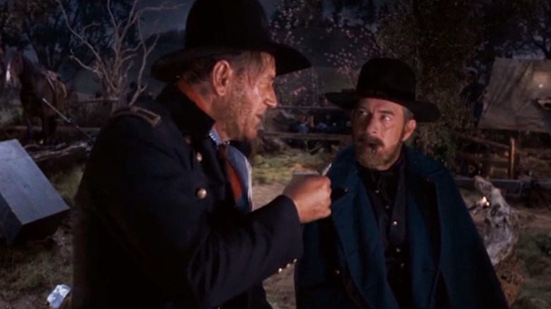 John Wayne's Gen. William Tecumseh Sherman talks to Harry Morgan's Gen. Ulysses S. Grant as they sit in a camp in How the West Was Won