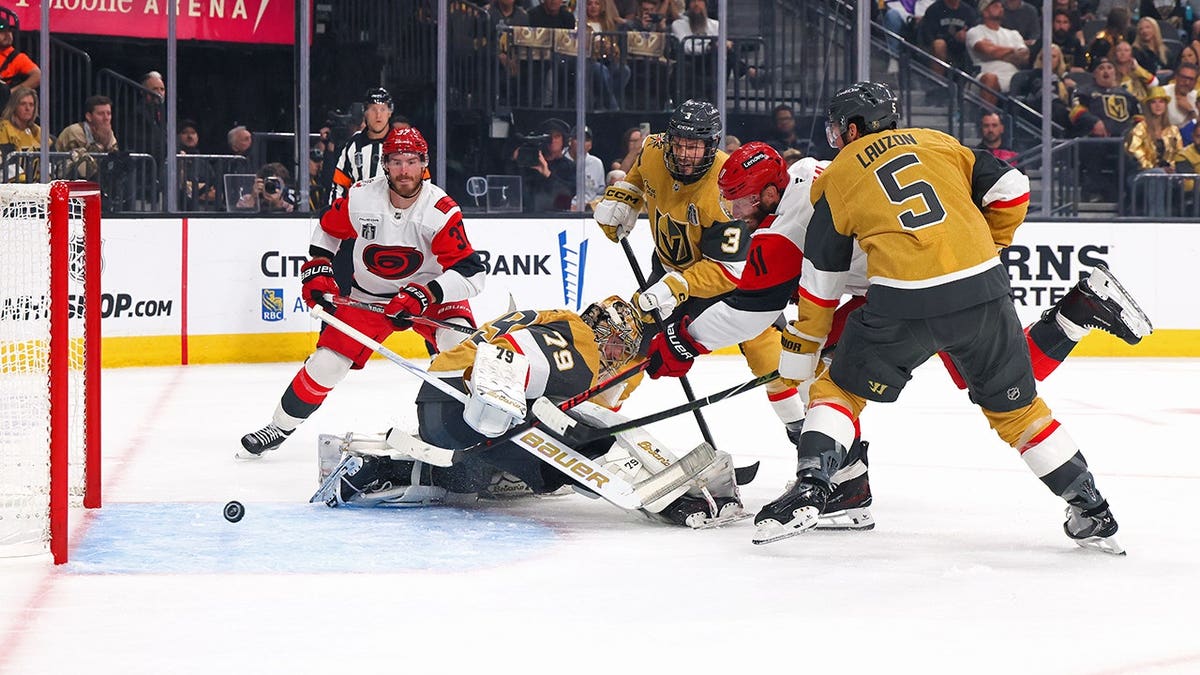 Jordan Staal scoring a goal against Carter Hart during a hockey game at T-Mobile Arena