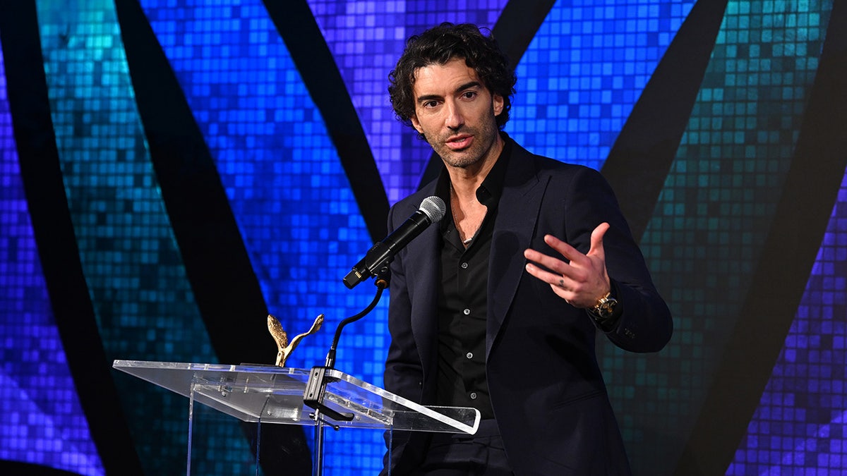 Actor and filmmaker Justin Baldoni speaking onstage at an event in New York City