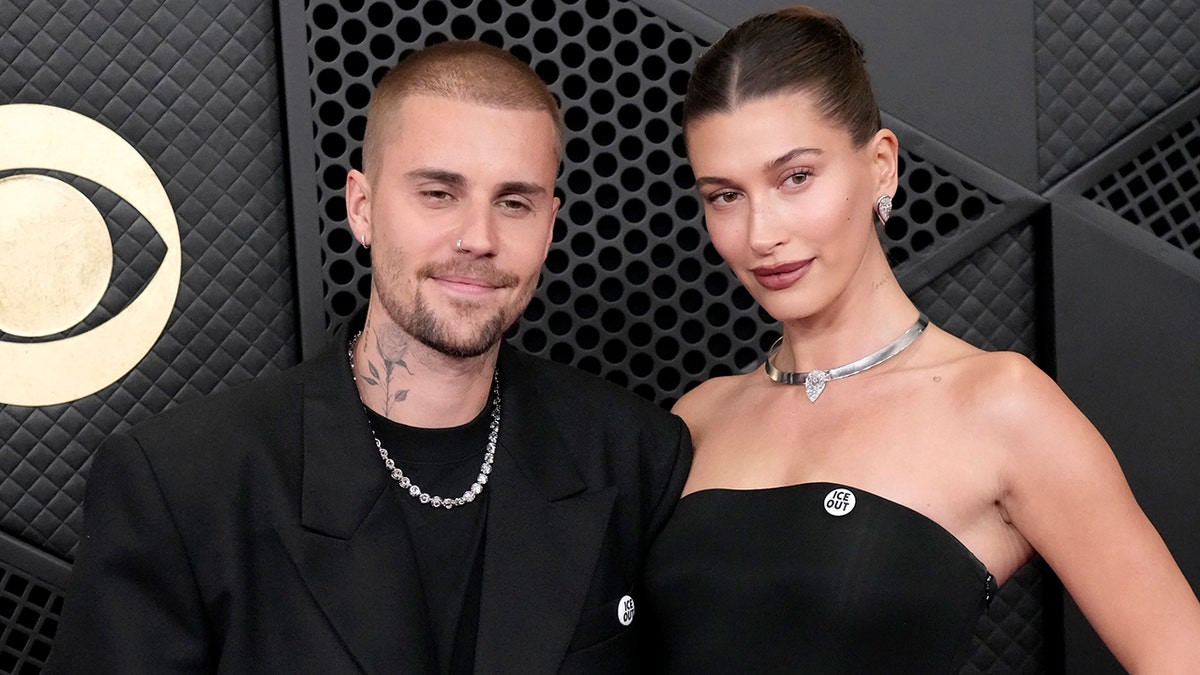 Justin Bieber and Hailey Bieber standing together at the Grammy Awards in Los Angeles