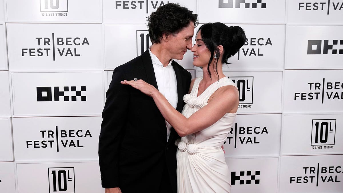 Justin Trudeau and Katy Perry standing together at the OKX Theater during the Tribeca Festival