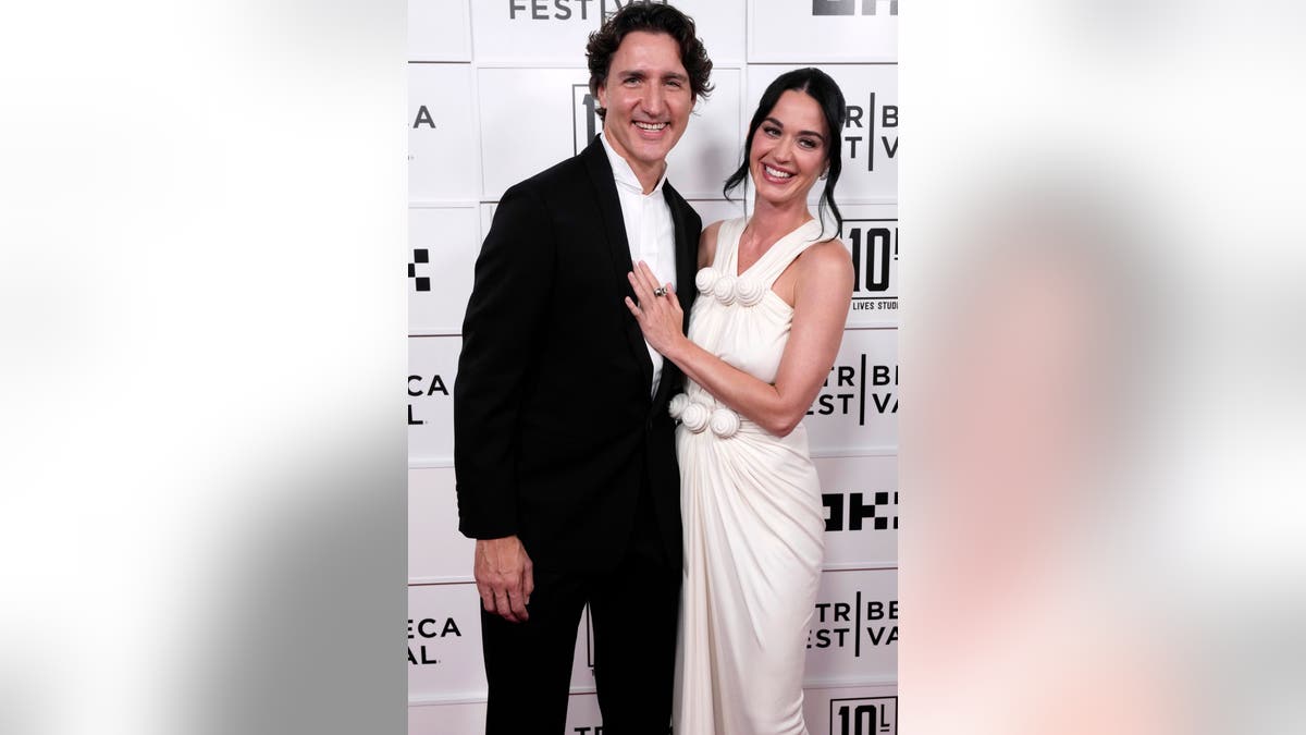 Justin Trudeau and Katy Perry standing together at the OKX Theater in New York