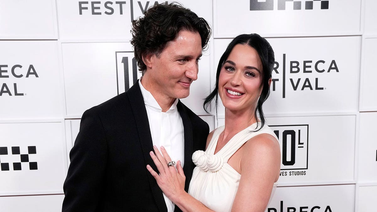 Justin Trudeau and Katy Perry standing together at the OKX Theater in New York