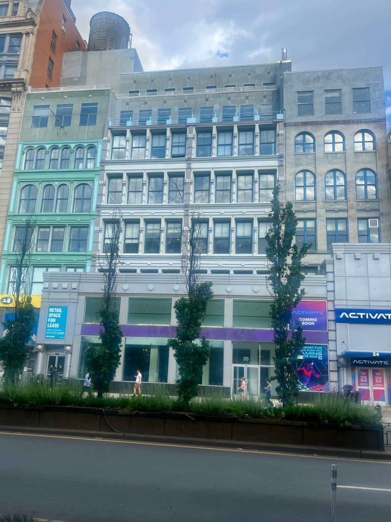 Street view of buildings in Union Square including a "Retail Space For Lease" sign and "Activate Coming Soon" signs.