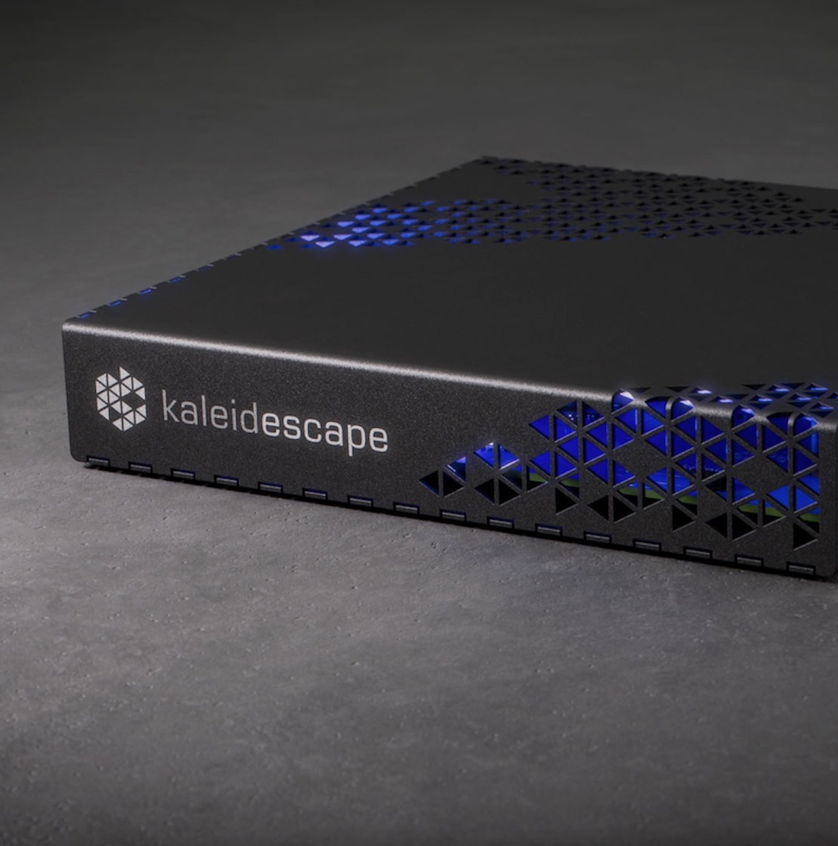 The Kaleidescape Strato E player on a gray surface.