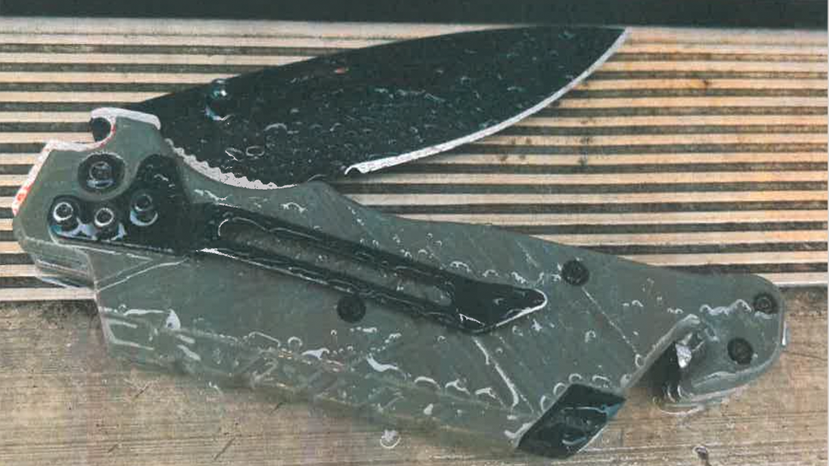 A folding pocketknife with a dark blade and gray handle used to murder Austin Metcalf is photographed by authorities at the scene in Texas.