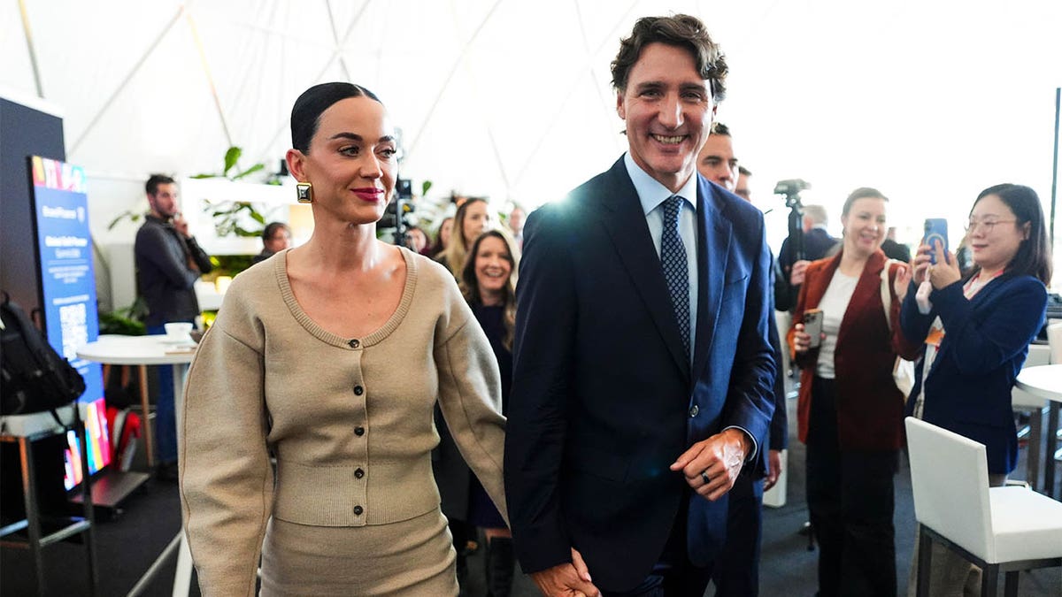 Katy Perry and Justin Trudeau holding hands at the World Economic Forum in Davos