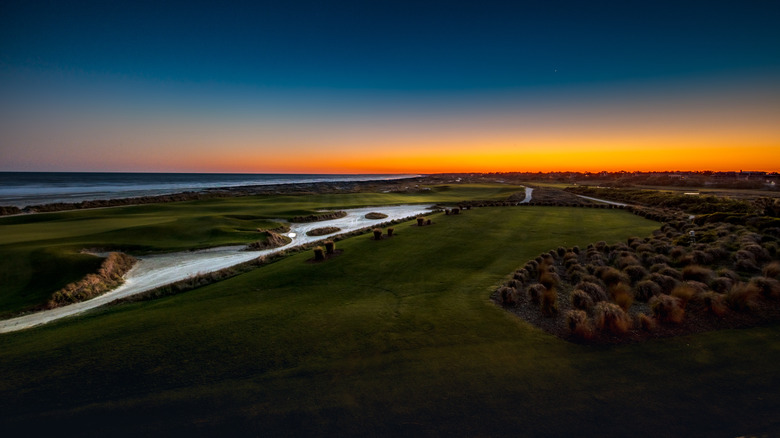 Sunset from the deck of the Ryder Cup bar at Kiawah Island, South Carolina overlooking the Ocean Course's 18th green