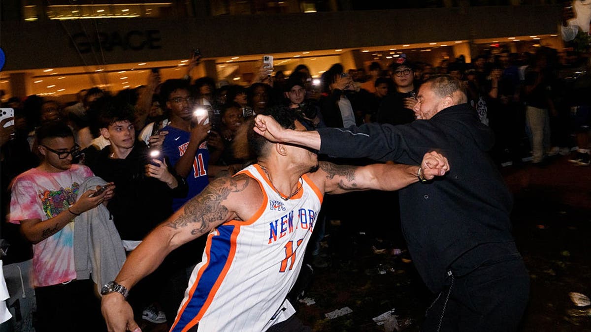 knicks fans fight outside of a watch party