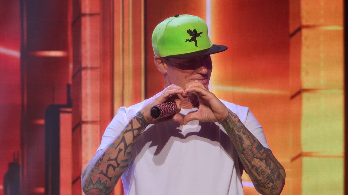 Vanilla Ice standing and speaking in a studio setting for KPopped.