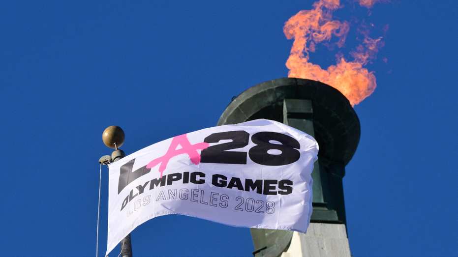 The LA28 Olympic cauldron is lit during a ceremonial lighting at the Memorial Coliseum in Los Angeles on January 13, 2026, ahead of the launch of ticket registration for the 2028 Summer Olympic Games. 