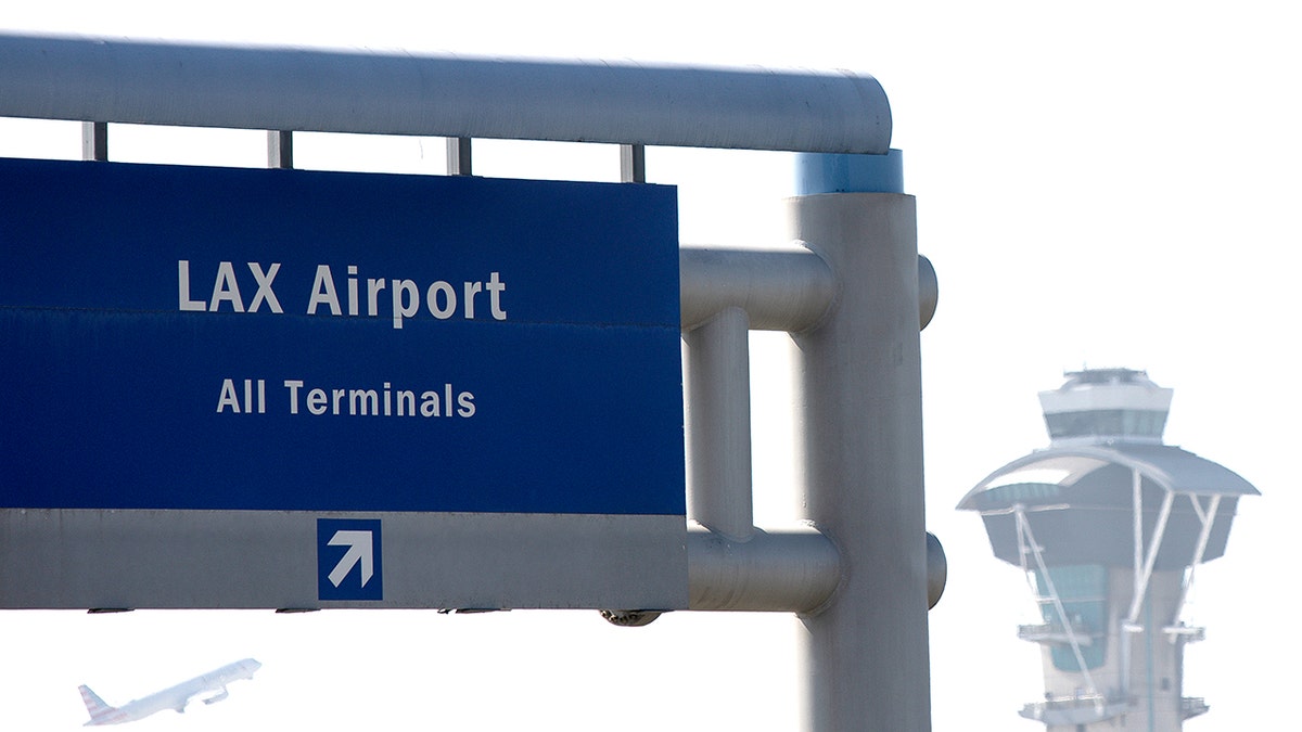 Air traffic control tower at Los Angeles International Airport with controllers working.