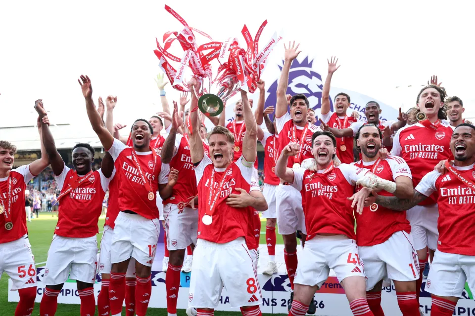 Arsenal lift the Premier League trophy.