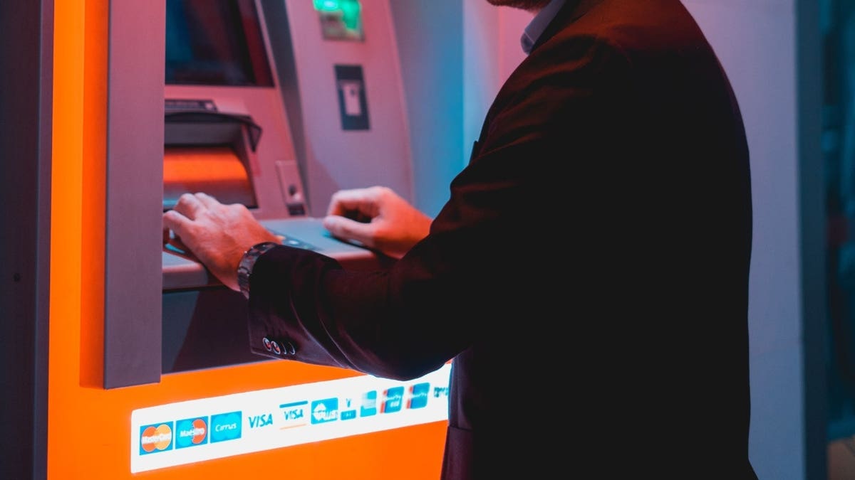 A man using an ATM